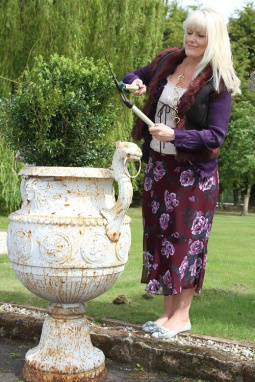 cast iron urn planter with lady.