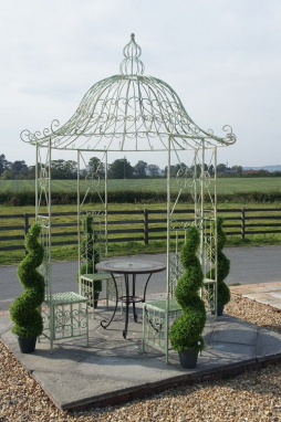 green round gazebo with table and chairs