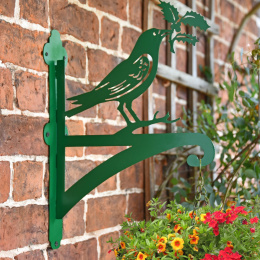 Green "Raven Holding Holly" Garden Hanging Basket Bracket On Brick Wall