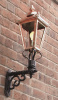 Copper Lantern on wall bracket in back yard