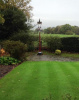Reclaimed victorian railway lamp post in garden
