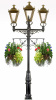 Traditional triple headed lamp post with flower baskets 